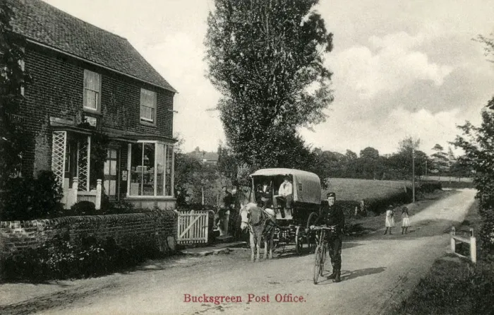 Framed Print : Bucks Green, West Sussex - The Post Office and local Postie Framed Print : Bucks Green, West Sussex - The Post Office and local Postie