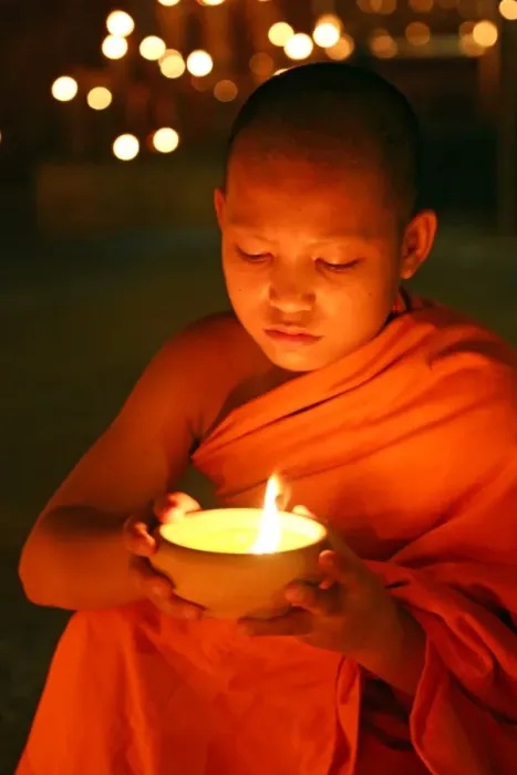 Framed Print : Buddhist Monk at Wat Phan Tao Temple holding candle Framed Print : Buddhist Monk at Wat Phan Tao Temple holding candle