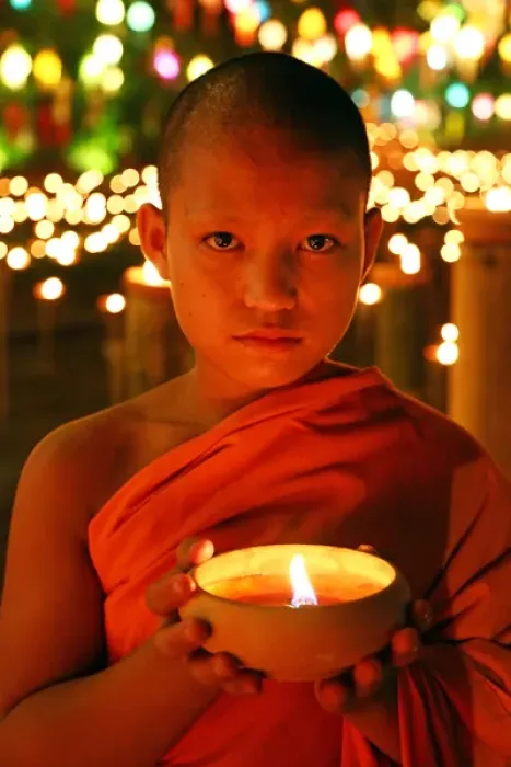 Framed Print : Buddhist Monk at Wat Phan Tao Temple holding candle Framed Print : Buddhist Monk at Wat Phan Tao Temple holding candle
