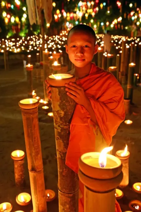 Framed Print : Buddhist Monk at Wat Phan Tao Temple holding candle Framed Print : Buddhist Monk at Wat Phan Tao Temple holding candle