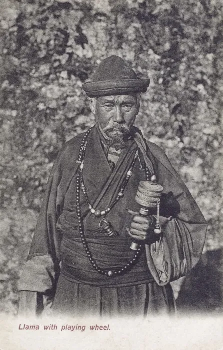 Framed Print : Buddhist Tibetan Lama holding a prayer wheel