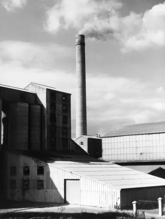 Framed Print : The buildings and smoking tower of a cement works in Great Britain. Date: 1950s Framed Print : The buildings and smoking tower of a cement works in Great Britain. Date: 1950s