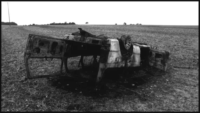 Framed Print : Burnt out car abandoned in a field Framed Print : Burnt out car abandoned in a field