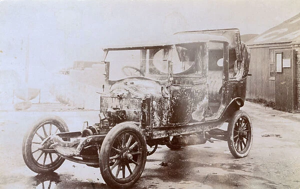 Burnt-out shell of an early motor car