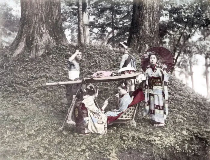 Framed Print : c. 1880s Japan - geishas carrying chair and bearers Framed Print : c. 1880s Japan - geishas carrying chair and bearers