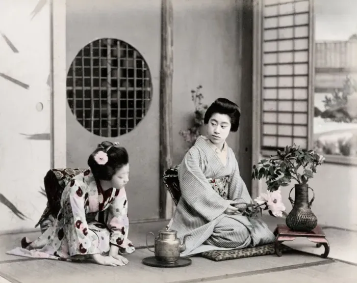 Framed Print : c. 1880s Japan - geishas with tea pot and flowers Framed Print : c. 1880s Japan - geishas with tea pot and flowers