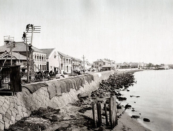 c. 1880s Japan - putting up telegraph poles and wires along Kobe bund