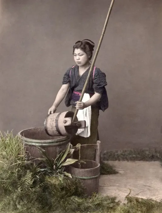Framed Print : c. 1880s Japan - young woman filling a bucket Framed Print : c. 1880s Japan - young woman filling a bucket