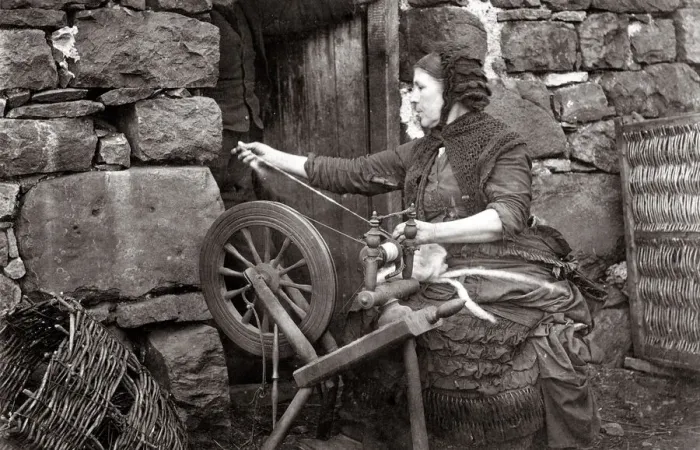 Framed Print : c. 1880s Scotland - woman spinning wool on a spinning wheel Framed Print : c. 1880s Scotland - woman spinning wool on a spinning wheel
