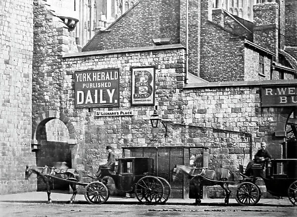 Cabs waiting at Bootham Bar, York, early 1900s
