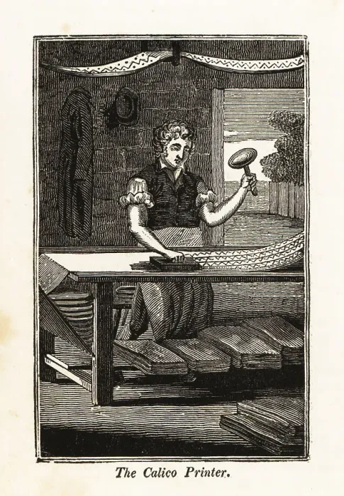 Framed Print : Calico-printer printing fabric with a woodblock in an atelier Framed Print : Calico-printer printing fabric with a woodblock in an atelier