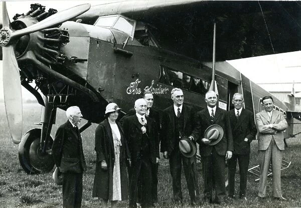 Capt C. D. Barnard, fourth from left, pilot, in front of ?
