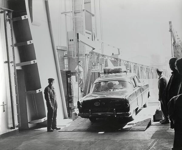 Car driving off a cross-channel ferry
