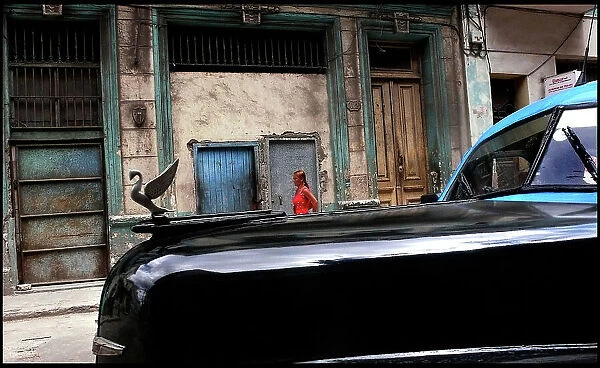 Car and woman in street, Havana, Cuba