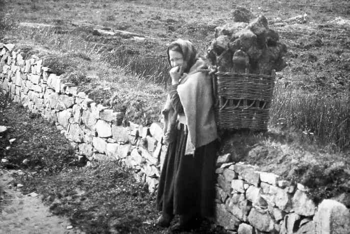 Framed Print : Carrying turf in a creel, West of Ireland, early 1900s Framed Print : Carrying turf in a creel, West of Ireland, early 1900s