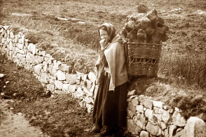 Framed Print : Carrying turf in a creel, West of Ireland, early 1900s Framed Print : Carrying turf in a creel, West of Ireland, early 1900s