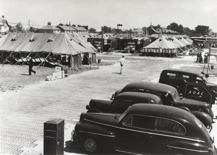 Framed Print : Cars Parked and Tents Used As Terminal Buildings with a ? Framed Print : Cars Parked and Tents Used As Terminal Buildings with a ?
