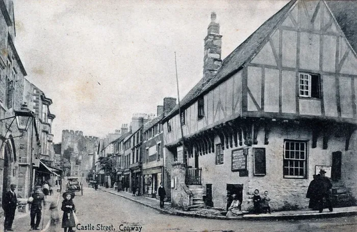 Framed Print : Castle Street, Conway, with timbered houses and castle Framed Print : Castle Street, Conway, with timbered houses and castle