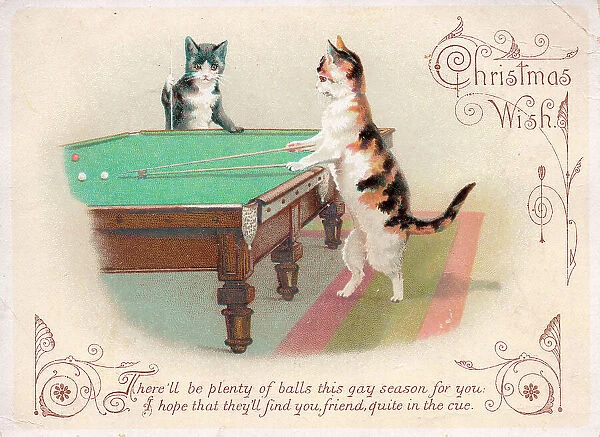 Two cats playing billiards on a Christmas card