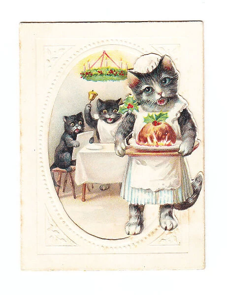 Three cats with pudding on a Christmas card