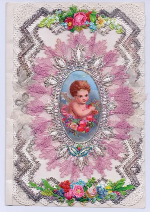 Framed Print : Cherub with flowers on a paper lace greetings card Framed Print : Cherub with flowers on a paper lace greetings card
