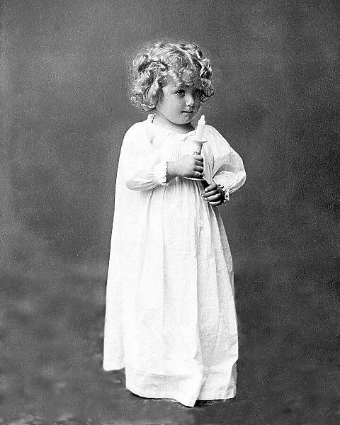 Child with candle ready for bed Victorian period