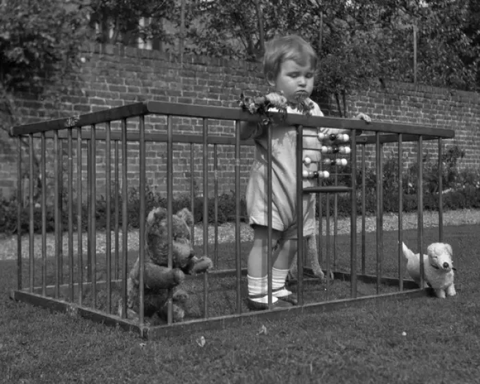 Framed Print : Child in a playpen in a garden Framed Print : Child in a playpen in a garden