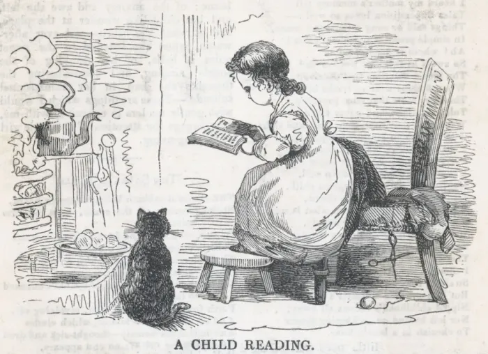 Framed Print : Child Reads by Stove Framed Print : Child Reads by Stove