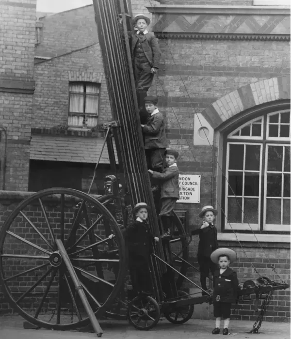 Framed Print : Children climbing up a wheeled escape ladder Framed Print : Children climbing up a wheeled escape ladder