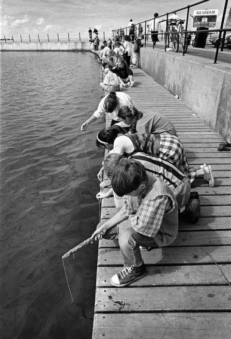 Framed Print : Children crabbing from a wooden pontoon at New Brighton Framed Print : Children crabbing from a wooden pontoon at New Brighton