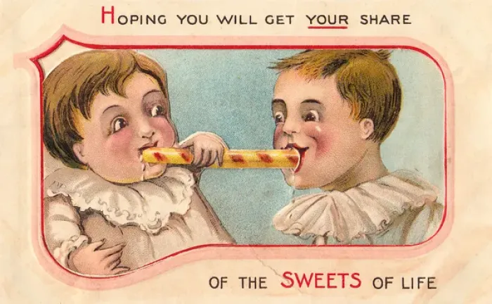 Framed Print : Two children eating sweets on a greetings card Framed Print : Two children eating sweets on a greetings card