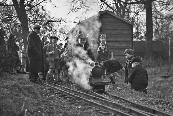 Children gathered around a miniature train