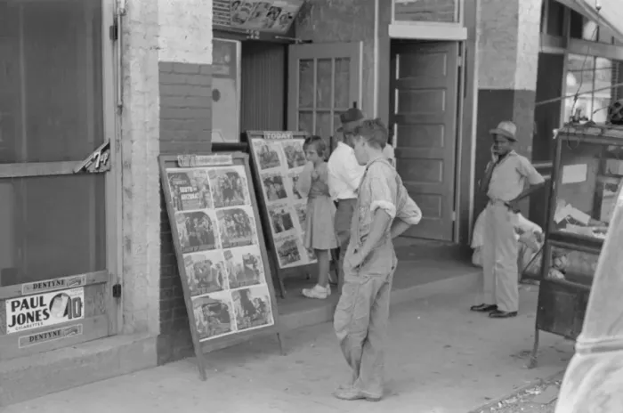 Framed Print : Children looking at posters in front of movie, Saturday, Ste Framed Print : Children looking at posters in front of movie, Saturday, Ste