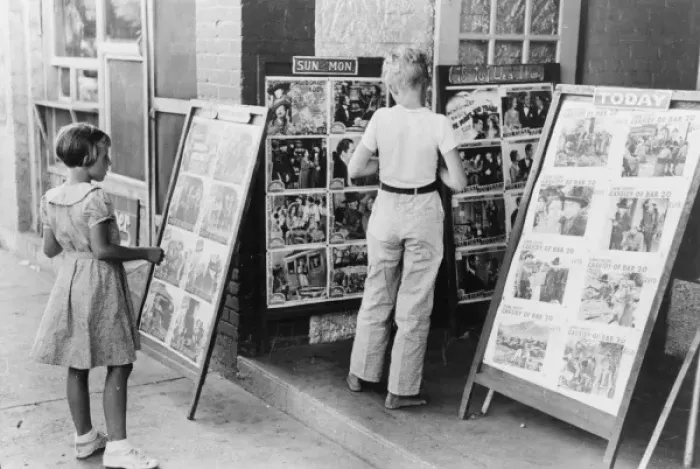 Framed Print : Children looking at posters in front of movie, Saturday, Ste Framed Print : Children looking at posters in front of movie, Saturday, Ste