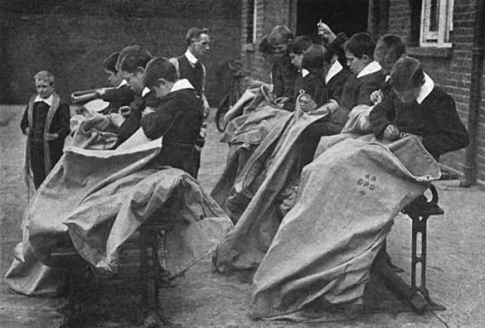 Framed Print : Children making mail bags for sending parcels to the front Framed Print : Children making mail bags for sending parcels to the front