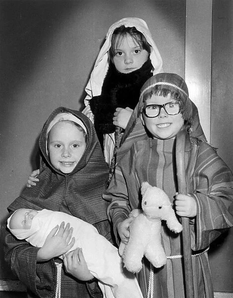 Three children in a nativity play
