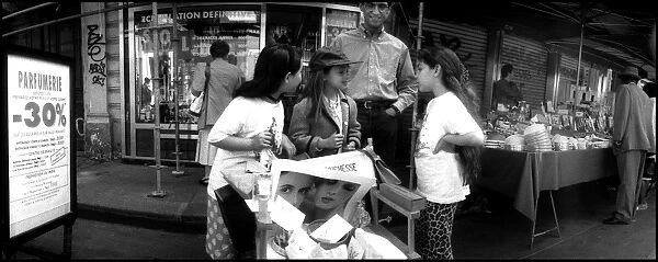 Children outside shop. Paris, France