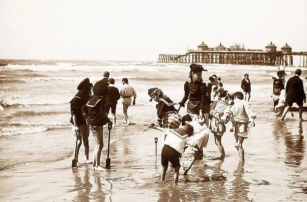 Children paddling on beach