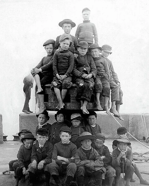 Children palying on quayside capstan