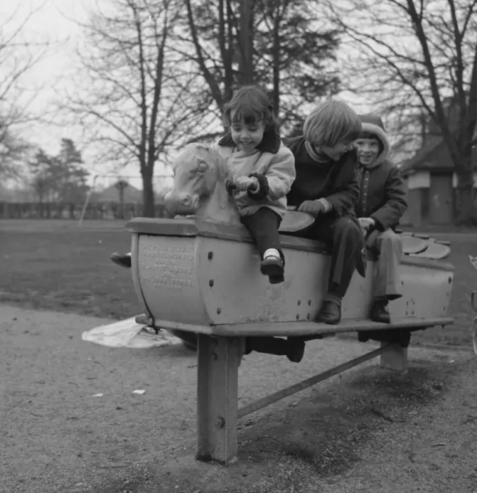 Framed Print : Three children on a playground ride Framed Print : Three children on a playground ride