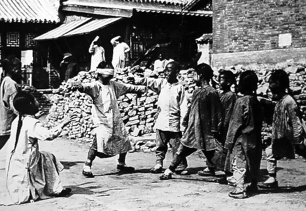 Children playing in China in the early 1900s