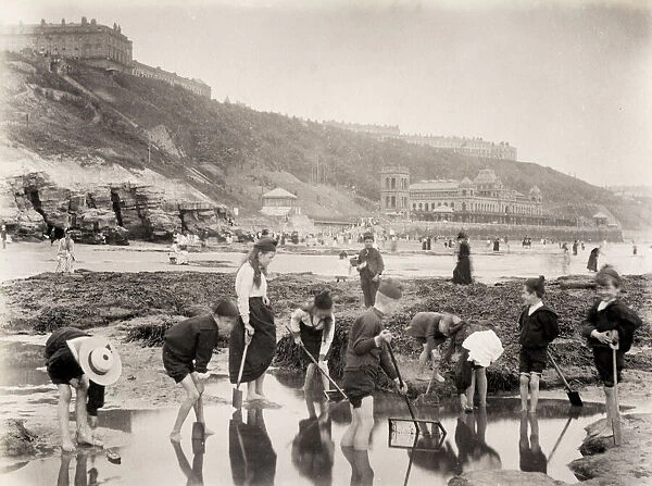 Children playing in pool on beach in Scarborough, Yorkshire