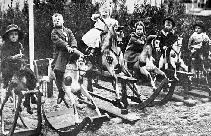 Framed Print : Children playing on rocking horses Framed Print : Children playing on rocking horses