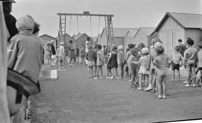 Framed Print : Children queueing up for a ride on the swings Framed Print : Children queueing up for a ride on the swings