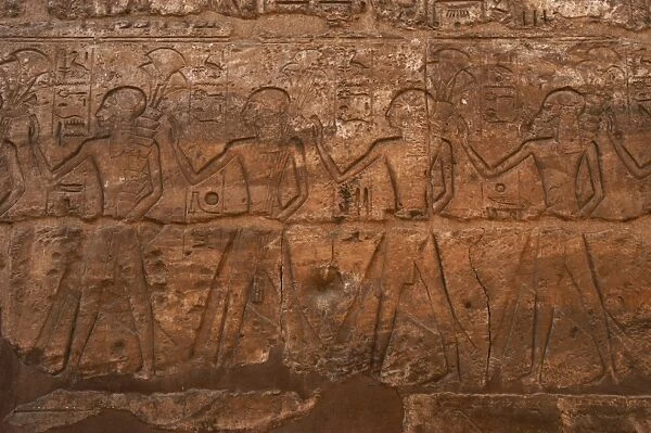 Children of Ramses II carrying flowers. Relief. Luxor temple