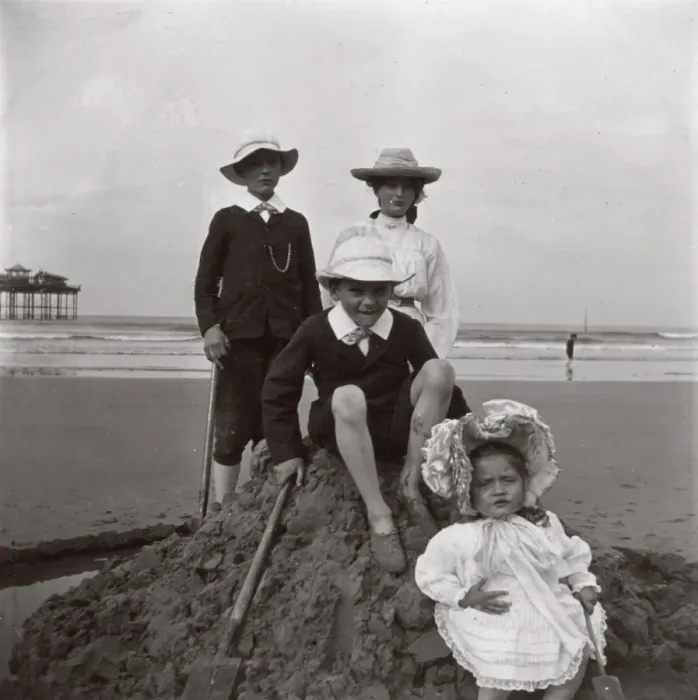 Framed Print : Four children on a sandcastle, Saltburn, North Yorkshire Framed Print : Four children on a sandcastle, Saltburn, North Yorkshire