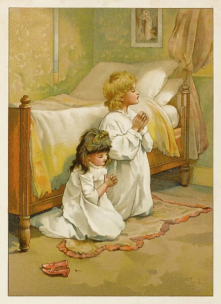 Two children saying their prayers before bed
