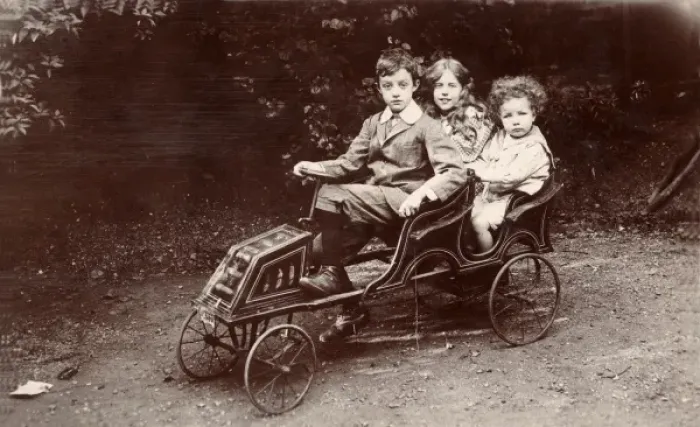 Framed Print : Three children in a toy car Framed Print : Three children in a toy car