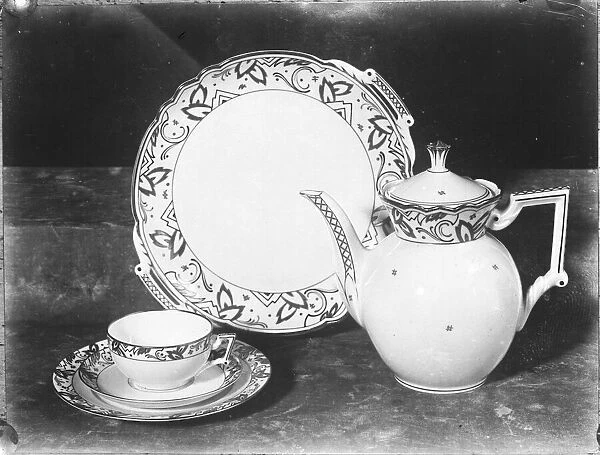China Tea Set. A china tea set - cup and saucer, teapot and plate for biscuits or cakes
