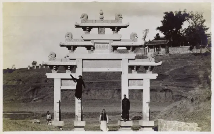 Framed Print : Chinese men fooling about on a Paifang Gateway, China Framed Print : Chinese men fooling about on a Paifang Gateway, China